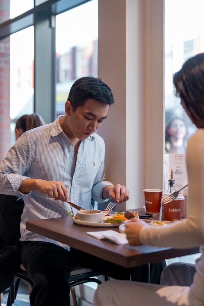 Customers enjoying brunch at LEKKER Café